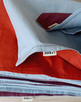Two-coloured tablecloth Brick red/Light blue